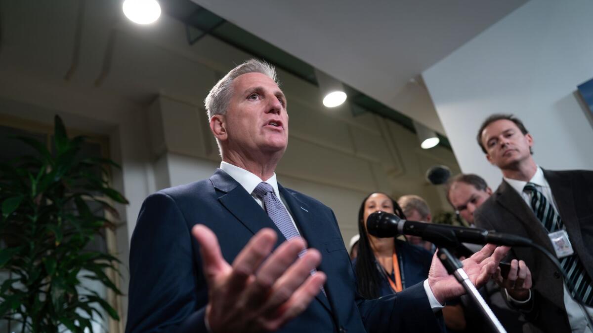 Kevin McCarthy talks to reporters following a closed-door meeting with House Republicans. — AP