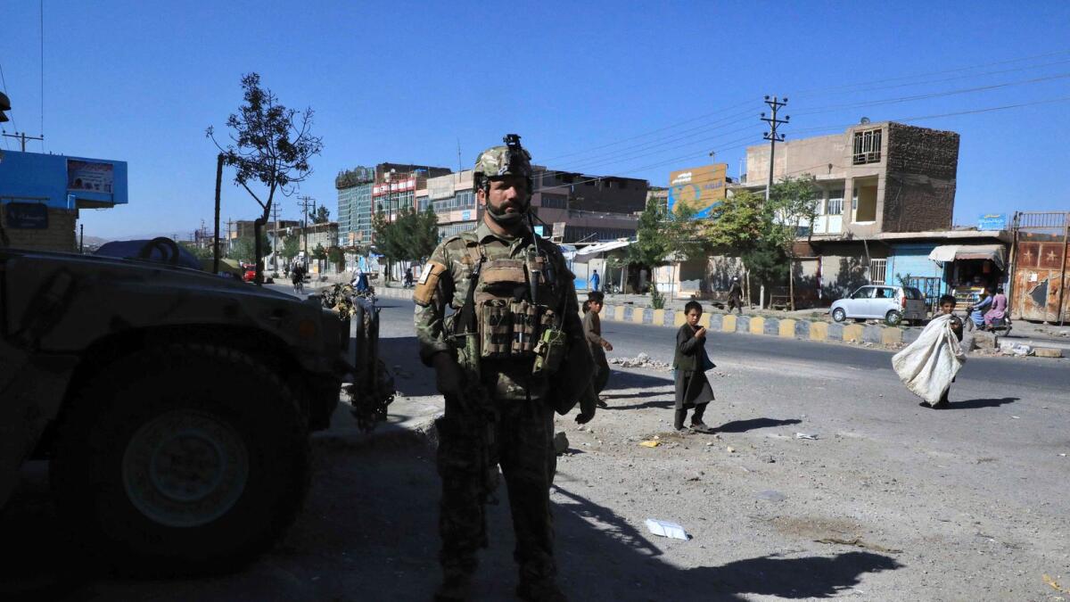 Afghan security forces stand guard along the roadside in Herat. Photo: AFP
