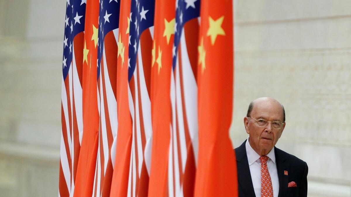China stands up for free trade as US commerce chief arrives