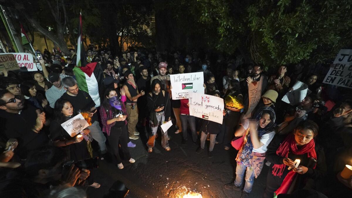 Palestinian supporters protest outside the Israeli embassy in Mexico City. — AP