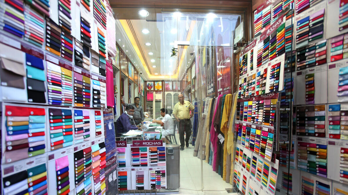 PALETTE OF COLOURS ... Swatches of fabrics welcome visitors at a shop at the Textile Souq.
