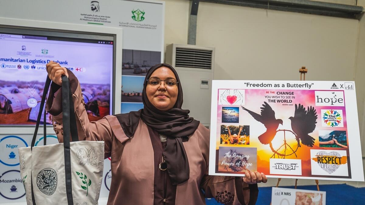 Amira Saif from Yemen presenting the Freedom as a butterfly bag that she designed during the Bag of Hope program in Dubai.-Photo by Neeraj Murali.