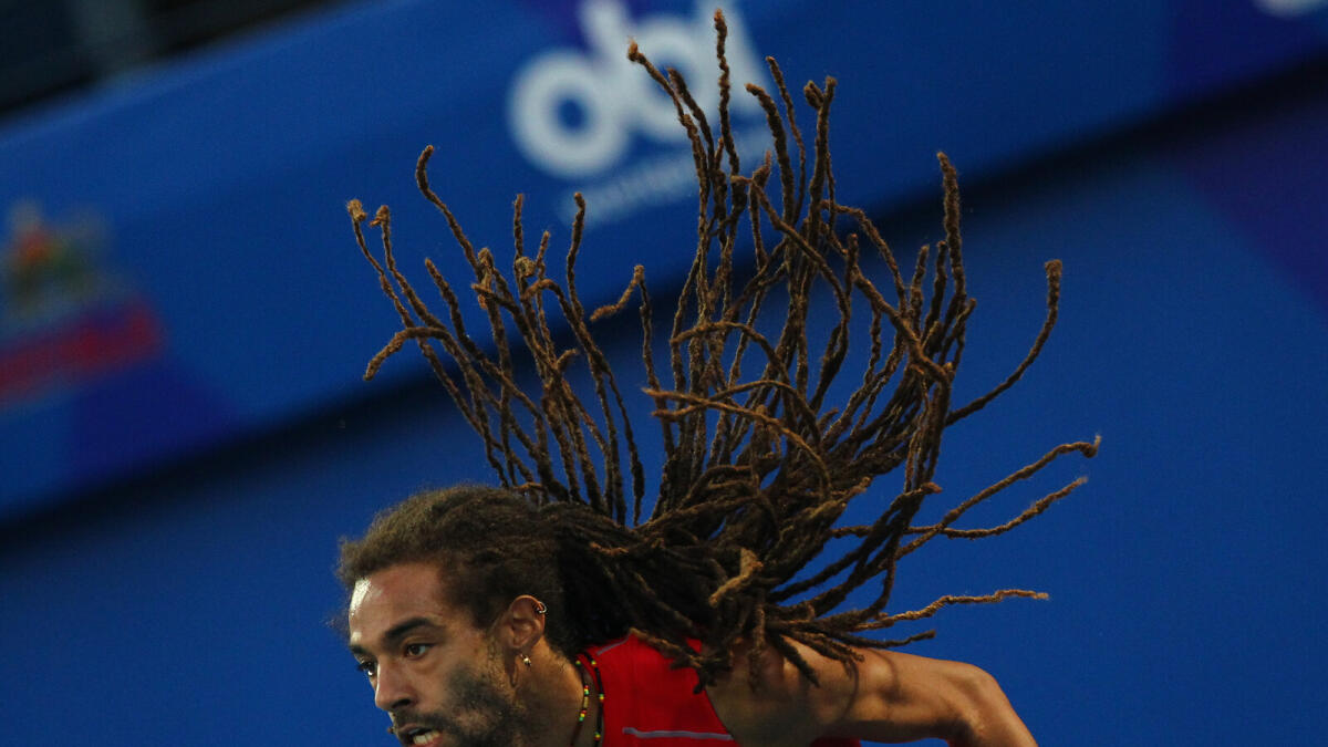 SP161215-SK-IPTLDustin Brown serve in mixed doubles with Karolina Pliskova (not in picture) against Sania Mirza and Ivan Dodig  during IPTL at Dubai Tennis Stadium on Wednesday. 16 December,2015. Photo by Shihab