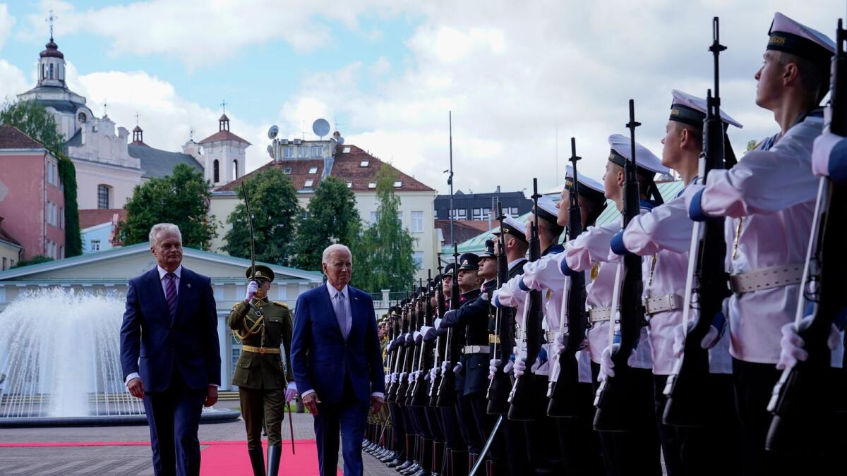 Lithuania's President Gitanas Nauseda, welcomes US President Joe Biden at the Presidential Palace prior the Nato summit in Vilnius, Lithuania, on Tuesday. — AP