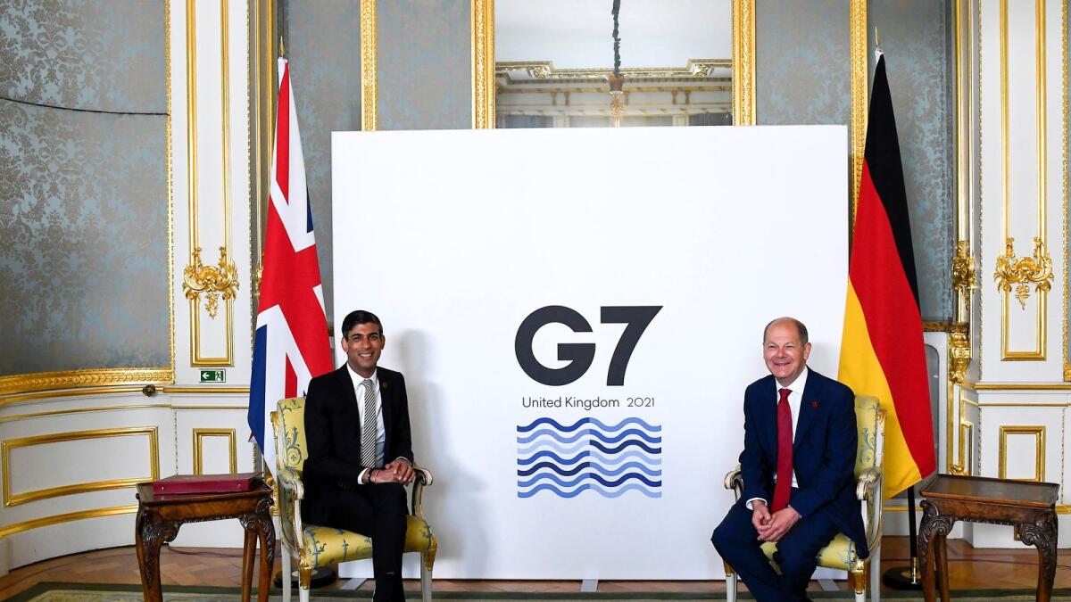 Britain's Chancellor of the Exchequer Rishi Sunak and Germany's Finance Minister Olaf Scholz pose seen on the second day of the G7 Finance Ministers Meeting, in London. Photo: AFP