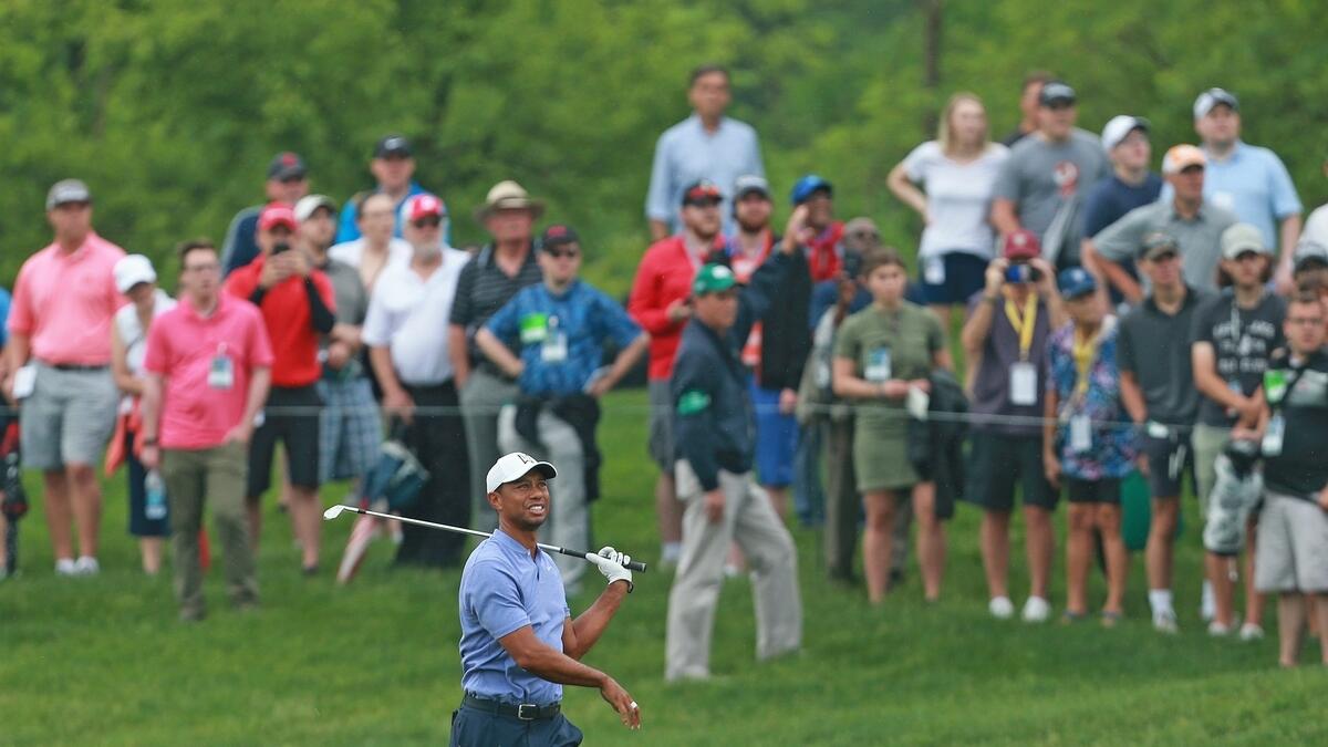 Woods shoots 70 as Moore takes clubhouse lead at Memorial