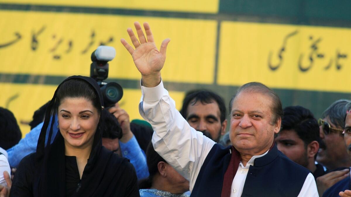 Nawaz Sharif (R) gestures to supporters as his daughter Maryam Nawaz looks on during partys workers convention in Islamabad, Pakistan.- Reuters