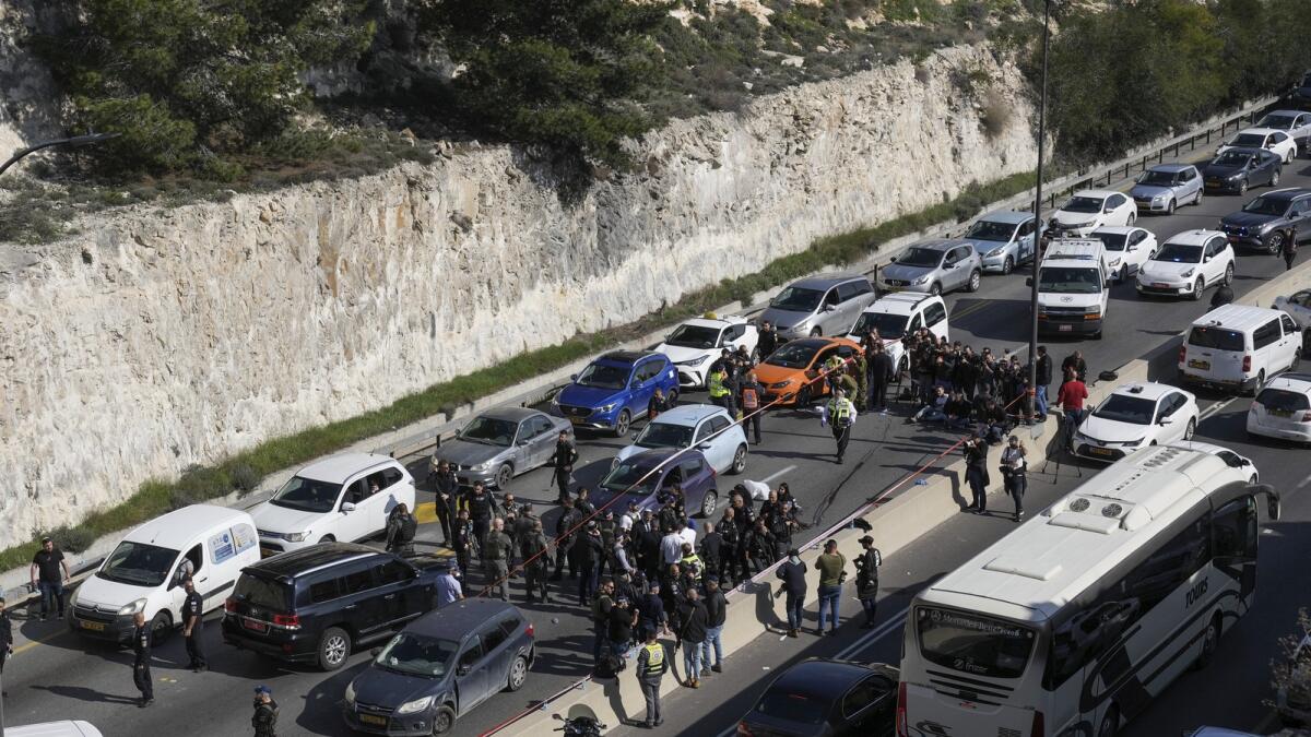Israeli security forces examine the scene of a shooting attack near the West Bank settlement of Maale Adumim. — AP