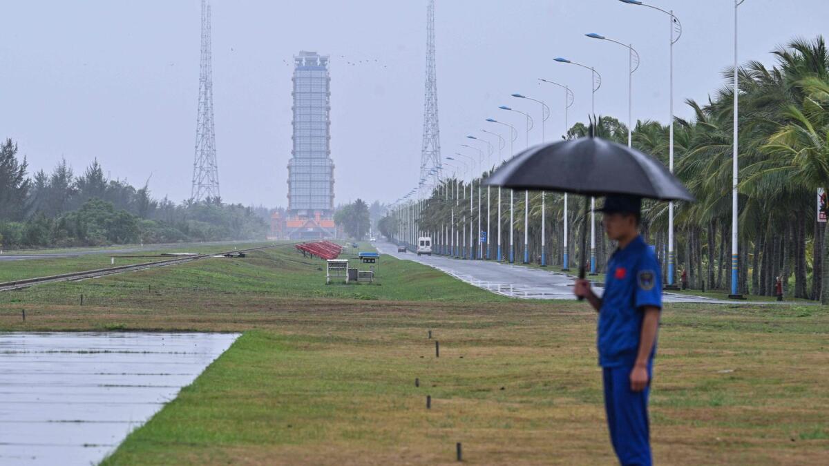 A guard keeps watch near the launch platform for the Chang'E-6 mission of the China Lunar Exploration Programme at the Wenchang Space Launch Centre in southern China's Hainan Province. — AFP