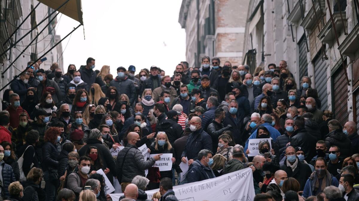 Protesters hold a demonstration against the Italian government's coronavirus disease (COVID-19) restrictions in Venice, Italy, November 3, 2020.