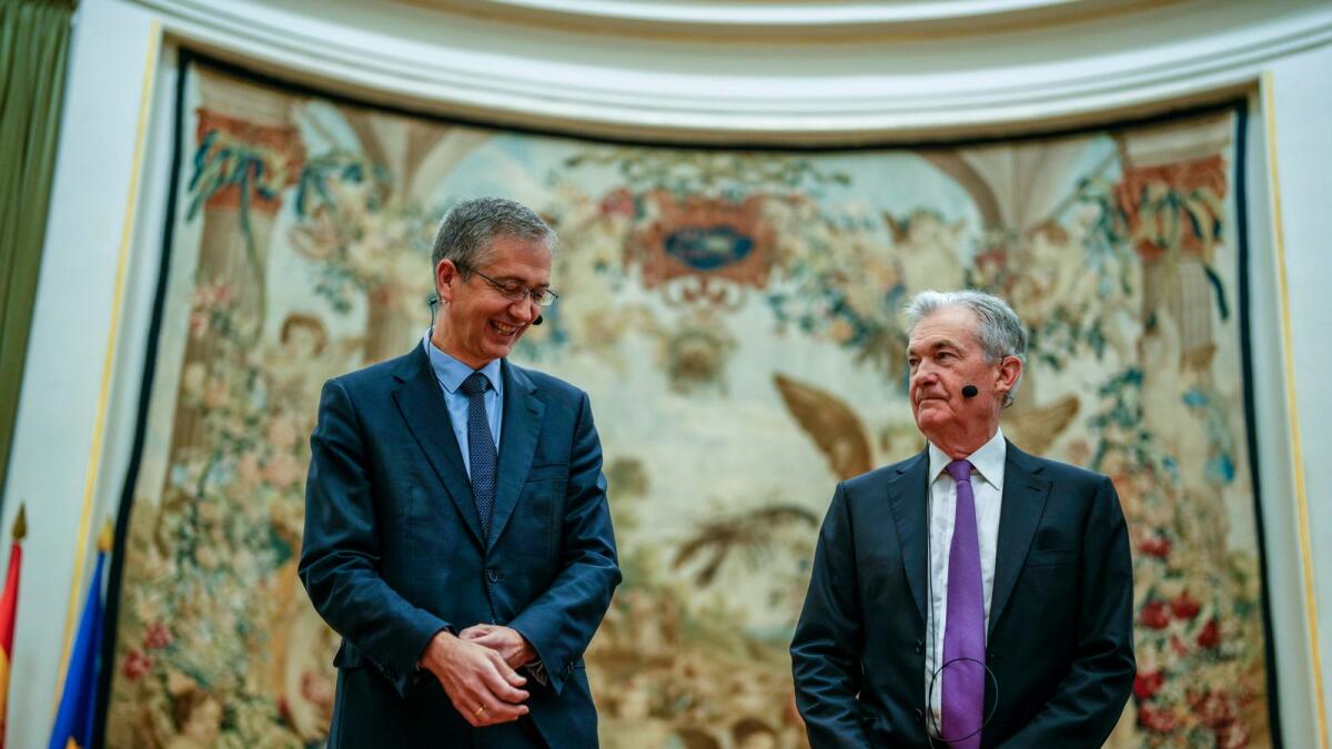 Federal Reserve Chairman Jerome Powell, right, and the Governor of the Bank of Spain, Pablo Hernandez de Cos at Spain's Central Bank in Madrid on Thursday. — AP