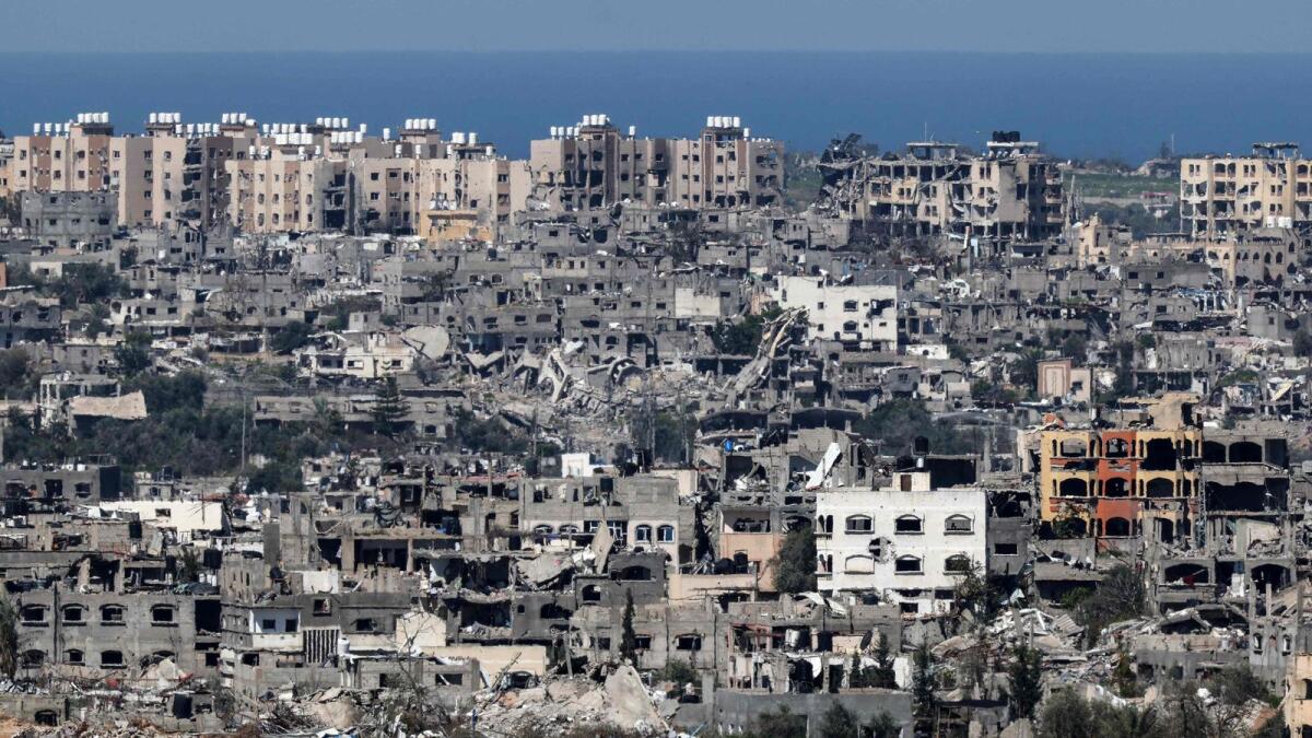 A picture taken from a position in southern Israel shows destroyed buildings in the Gaza Strip. — AFP