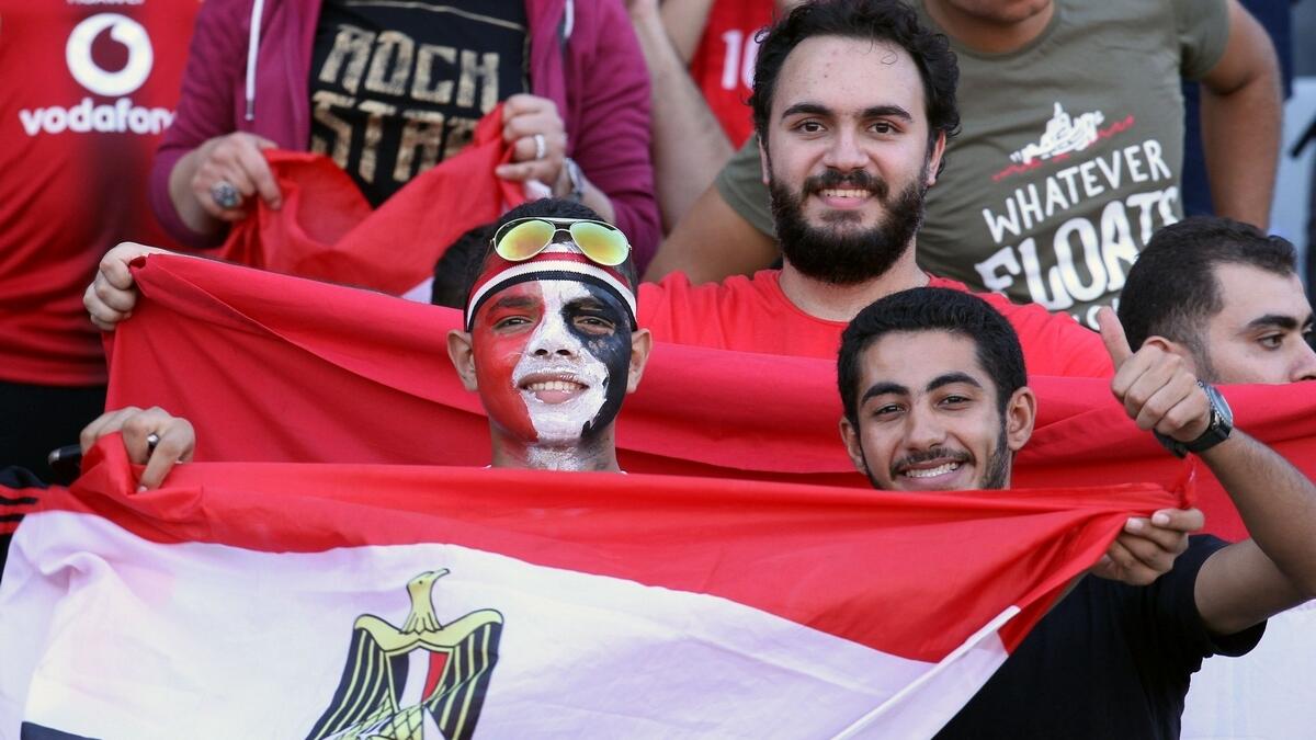 Egyptians celebrate their victory in a soccer match against Congo that qualifies Egypt for the World Cup.