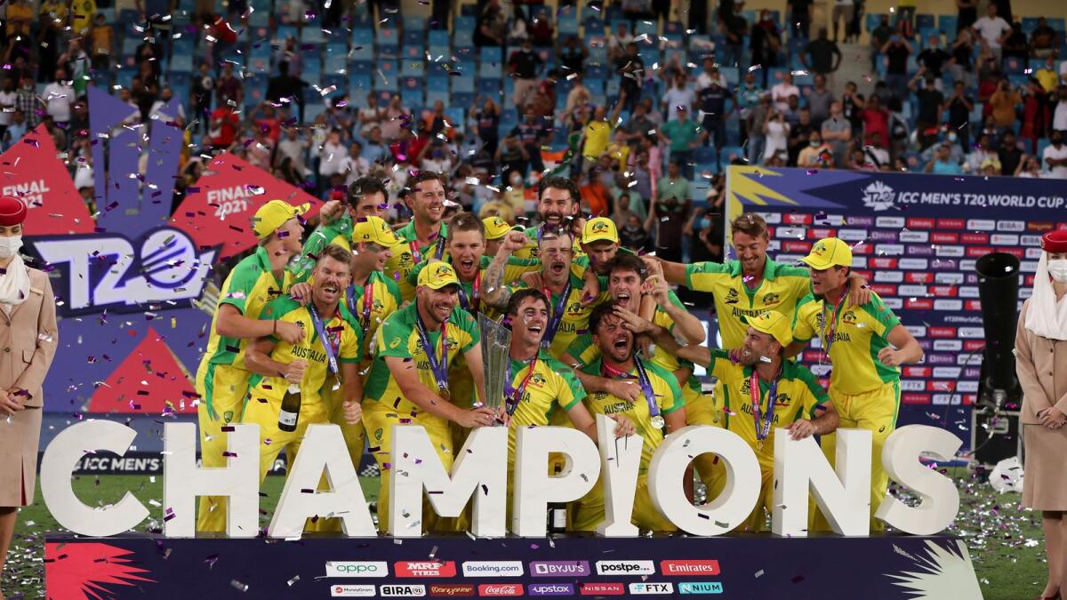 Australia celebrate with the trophy after winning the T20 World Cup final in Dubai last November. — AP