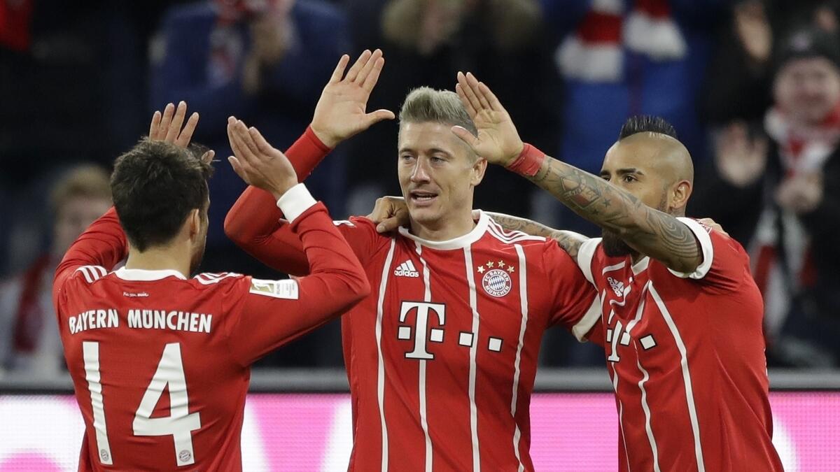 Lewandowski double puts Bayern six points clear