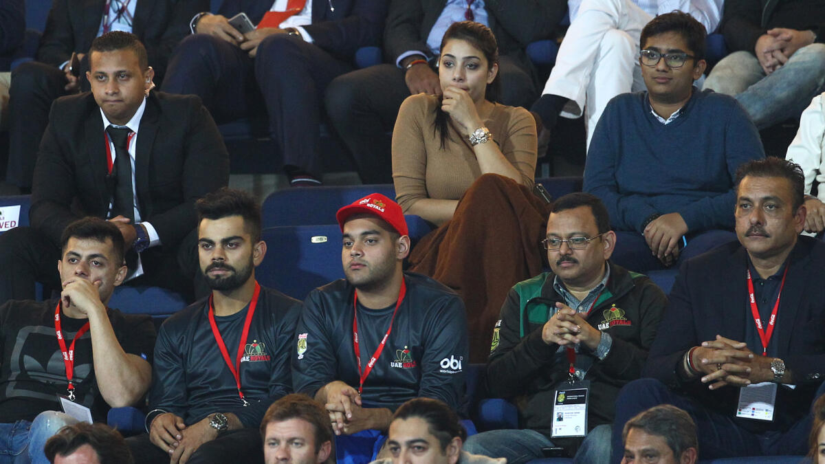 SP161515-SK-IPTL Virat Kohli and Ravi Shastri watching IPTL at Dubai Tennis Stadium on Tuesday. 15 December,2015. 