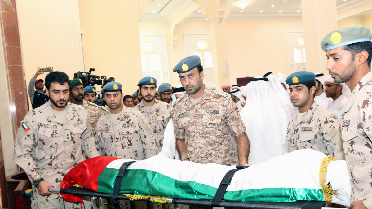Soldiers taking the the body of 25-year old UAE martyr Zayed Ali Al Kaabi for funeral prayers in his hometown Mebreh in Fujairah. — Supplied photo