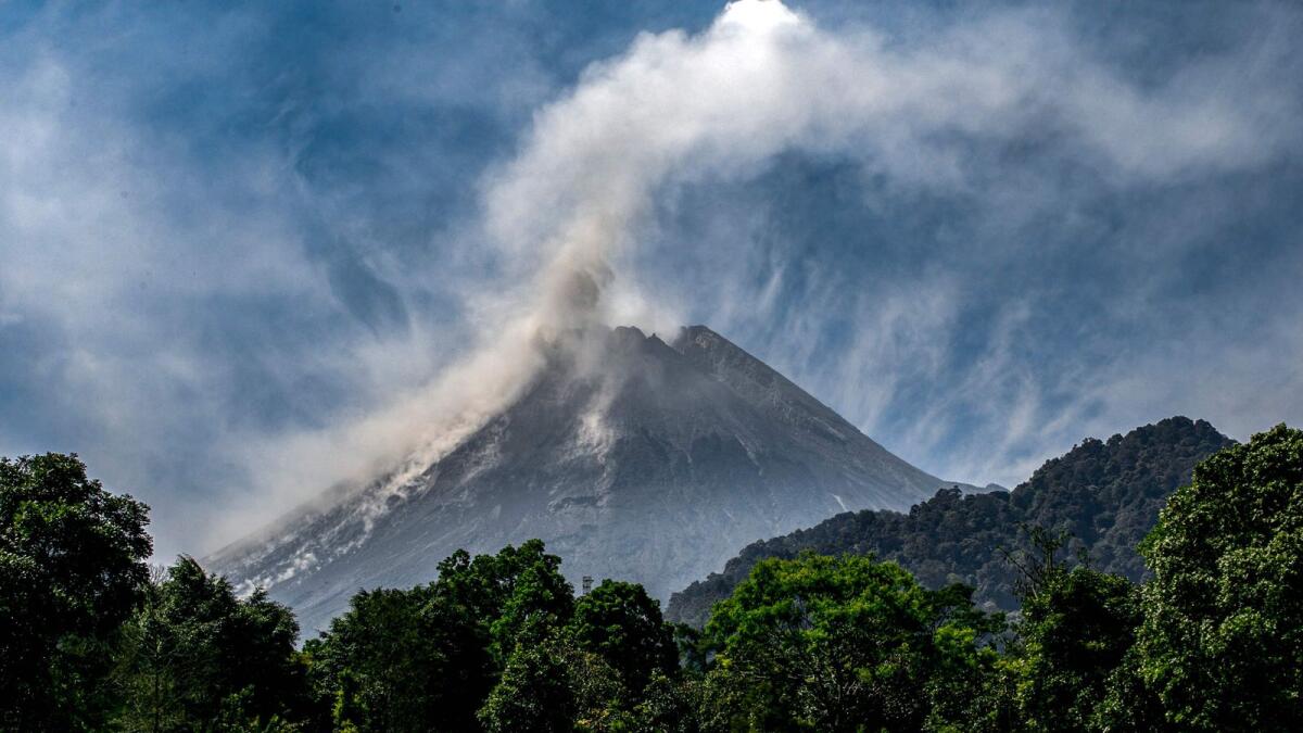 Mount Merapi billows smoke into the air and lava onto its slopes during its eruption as seen from Hargobinangun village, in Sleman on July 27, 2023. (Photo: AFP file) For illustrative purposes only.