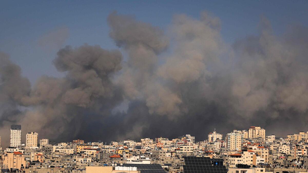 Smoke billows during Israeli air strikes in Gaza City. — AFP