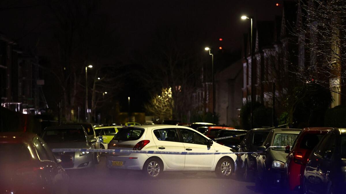 A car is seen behind police cordon after a suspected acid attack in south London on February 1. — AFP
