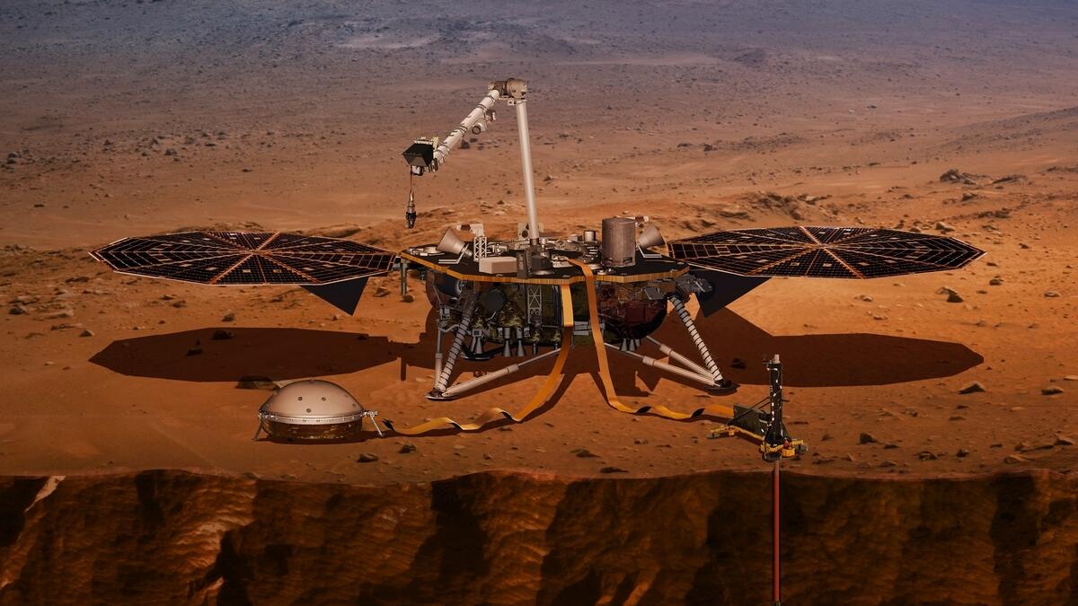 The illustration made available by Nasa in 2018 shows the InSight lander drilling into the surface of Mars.