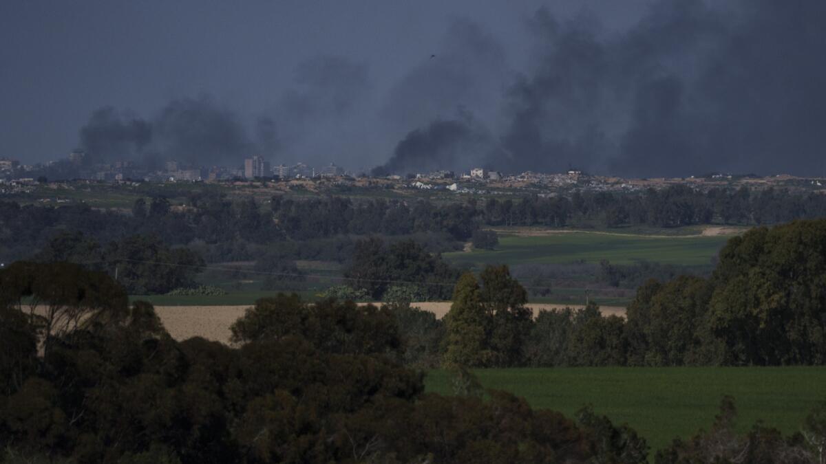 Smokes rise to the sky after explosions in the Gaza Strip as seen from southern Israel. — AP