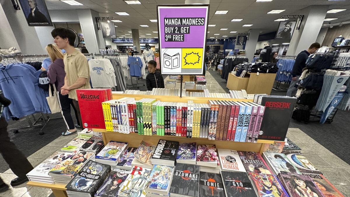 Graphic novels are displayed for sale at a bookstore in New York City. The spike in spending comes despite attempts by the Federal Reserve to cool spending and hiring. — AP