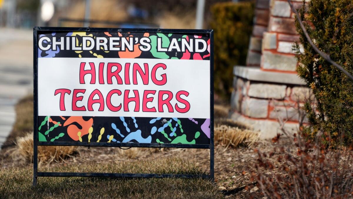A hiring sign is displayed at a learning center in Mount Prospect, Illinois. US payroll growth in the decade before the Covid-19 pandemic averaged about 180,000 per month. - AP