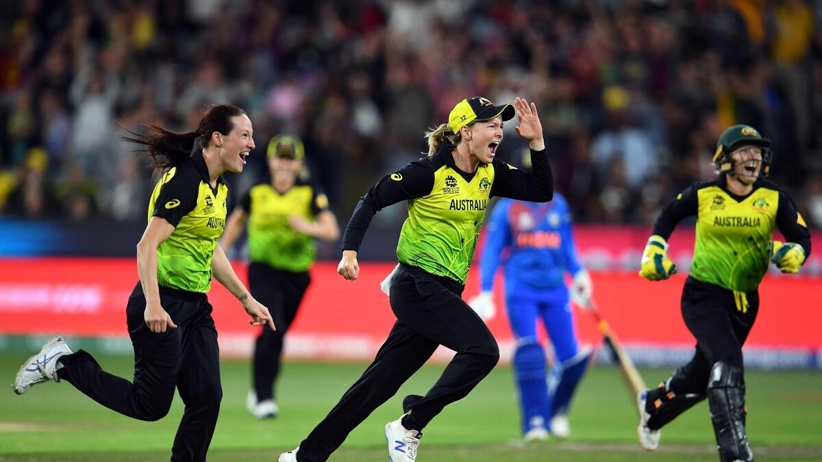 Australia's players celebrate after their victory against India during the Twenty20 Women's World Cup final in Melbourne on Sunday