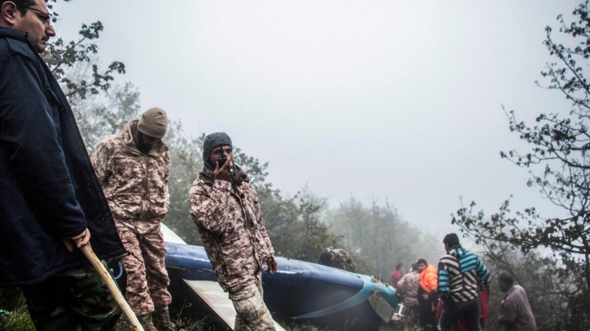Rescue team members work at the crash site of a helicopter carrying Iranian President Ebrahim Raisi in Varzaghan, in northwestern Iran, on May 20. — Photo: AFP file