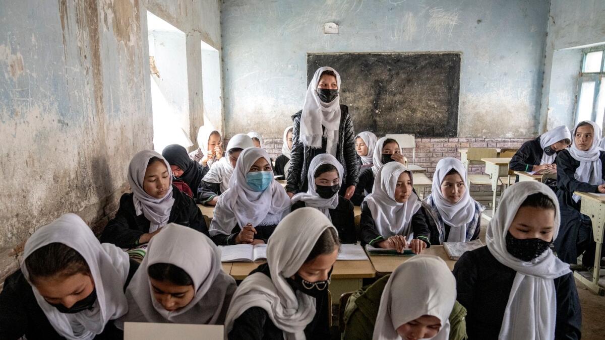 Afghan school girls attend their classroom on the first day of the new school year in Kabul on March 25, 2023. High school remained closed for girls for the second year after Taliban returned to power in 2021. — AP