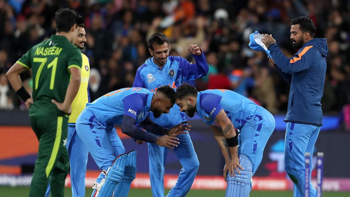 India's Virat Kohli (right) and Hardik Pandya celebrate the win. — AFP