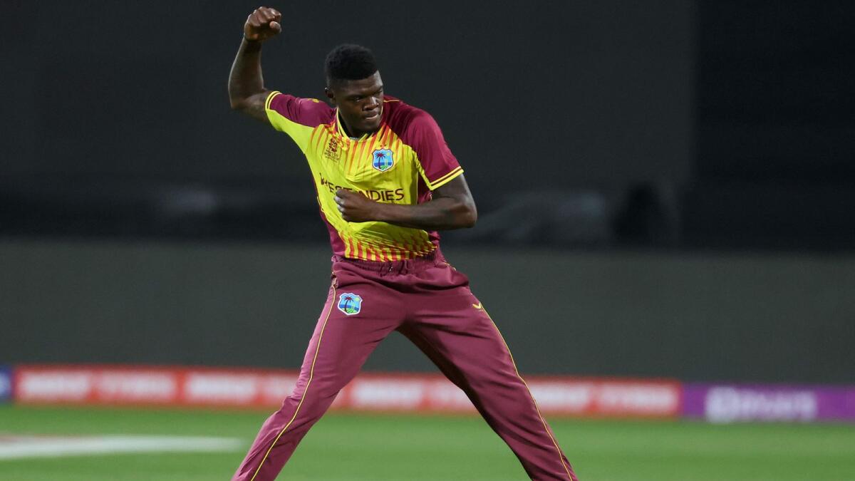 West Indies' Alzarri Joseph celebrates after taking the wicket of Zimbabwe's Luke Jongwe at Bellerive Oval in Hobart on Wednesday. — AFP
