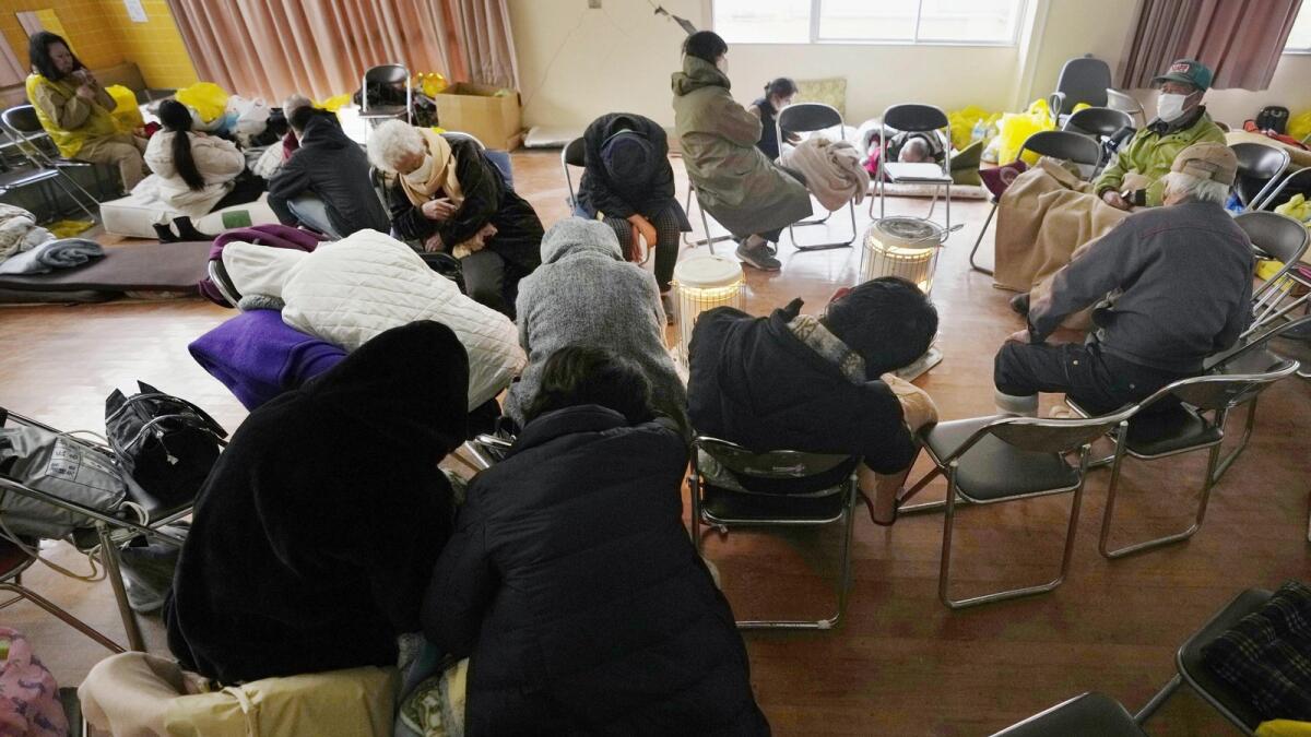 Evacuees rest at a temporary evacuation center in Suzu in the Noto peninsula. — AP