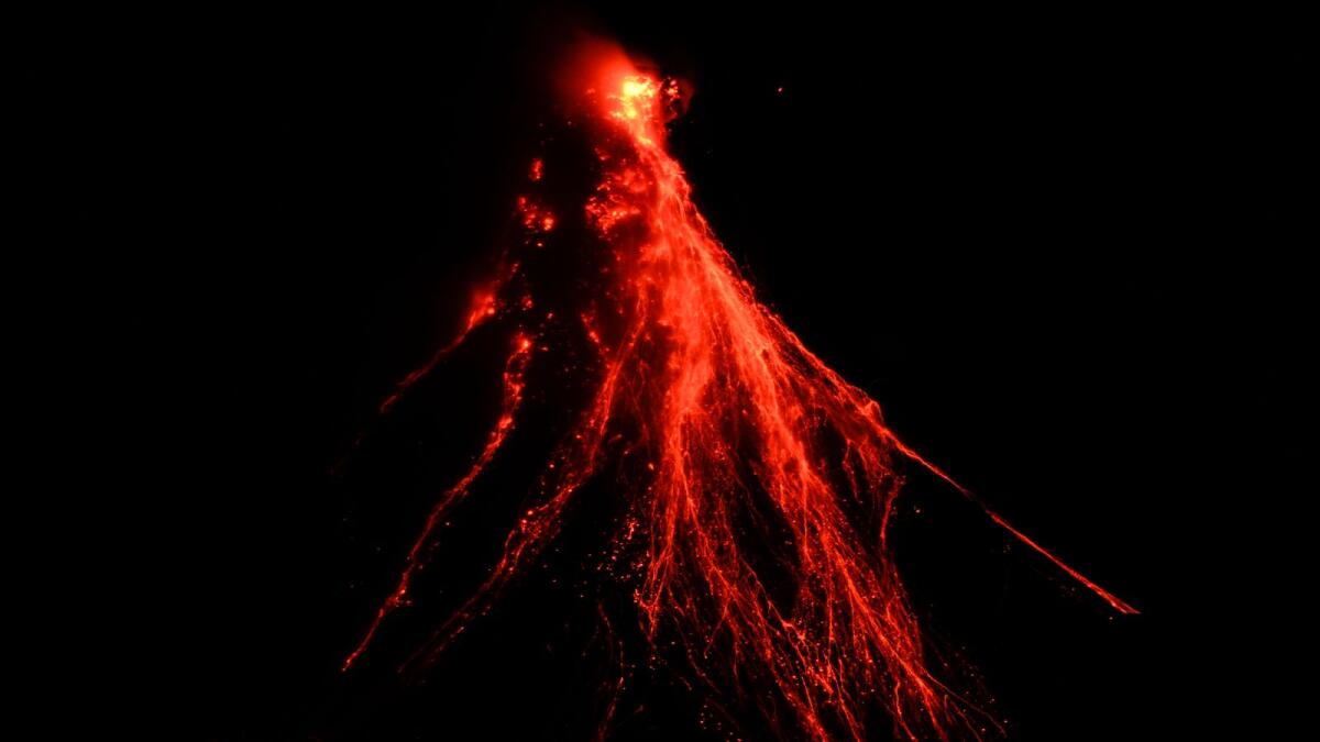 Lava flows down the slopes of Mayon volcano as seen from Legazpi, Albay province, northeastern Philippines, on June 15, 2023. -- AP
