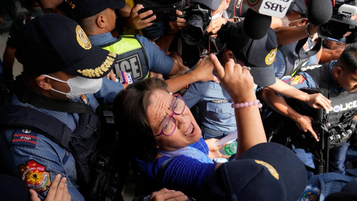 Detained ex-senator Leila de Lima reacts as she goes out of the Muntinlupa trial court to attend her trial on May 12, 2023 in Muntinlupa, Philippines.— AP file