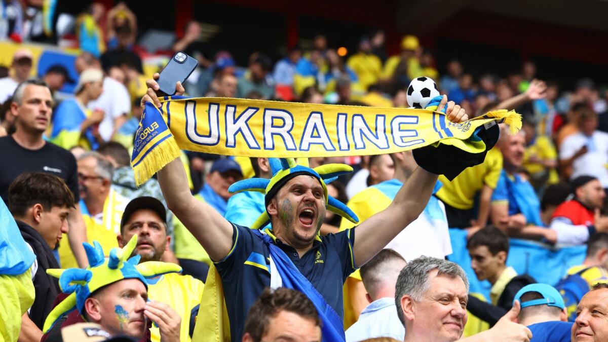 Ukraine fans celebrate after the match. — Reuters