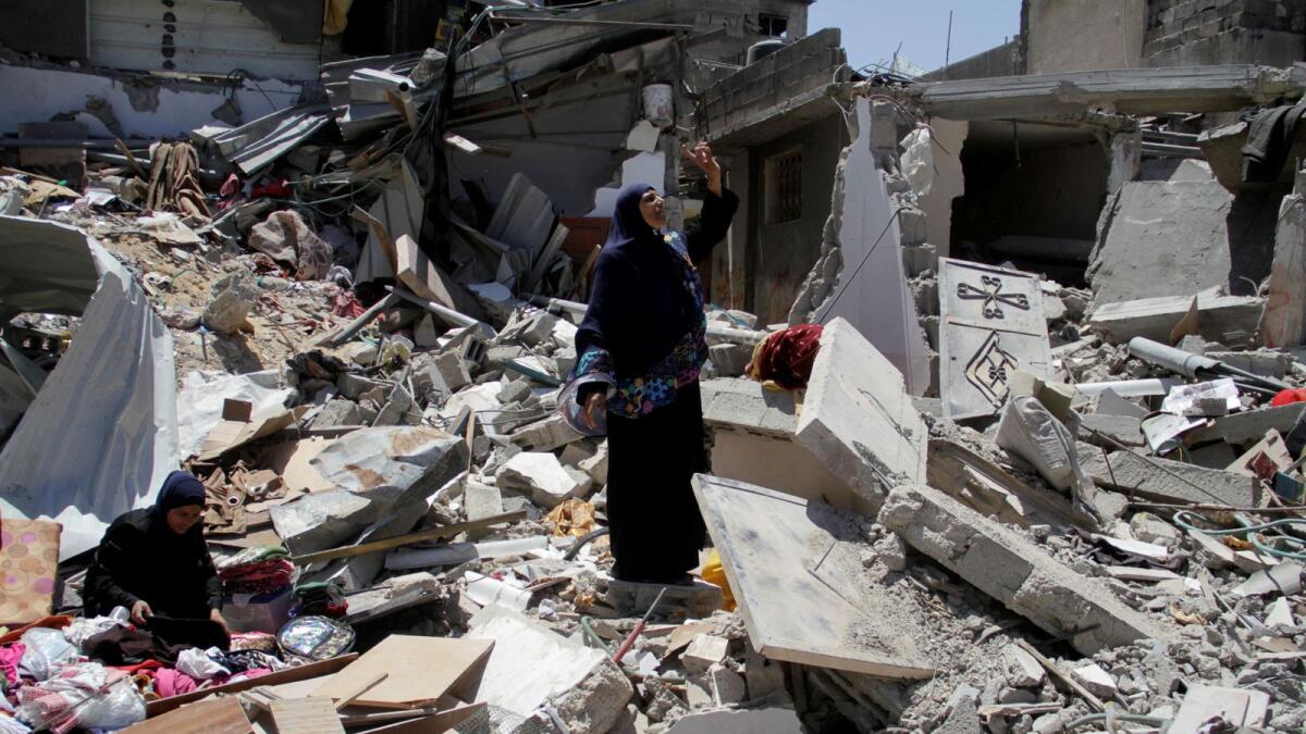 A Palestinian woman reacts, as she inspects the damage after Israeli forces withdrew from Jabalia refugee camp. — Photo: Reuters