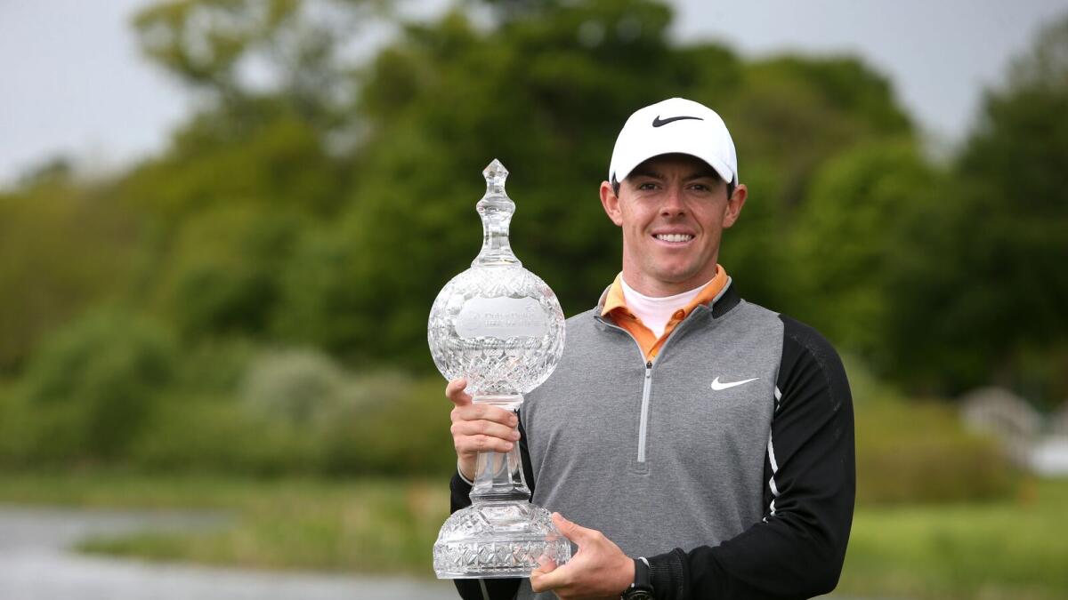 Rory McIlroy holds the trophy after winning the Irish Open. — AP