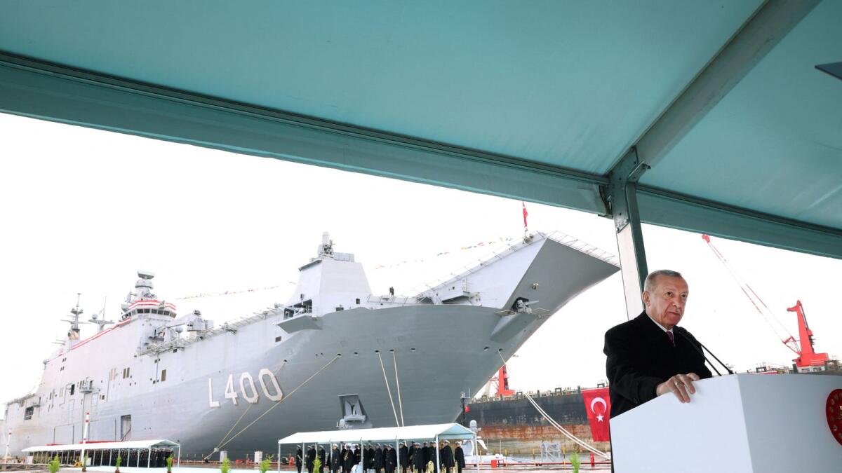 Turkey's President Tayyip Erdogan addresses the audience during a ceremony for the launch of amphibious assault ship TCG Anadolu in Istanbul on Monday. — Reuters