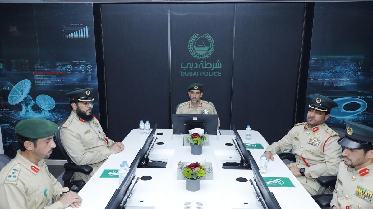 Lieutenant General Abdullah Khalifa Al Marri and other officers during a performance review meeting.