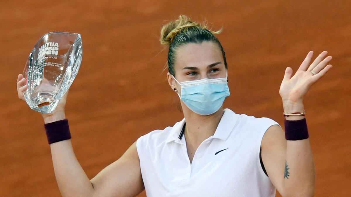 Belarus' Aryna Sabalenka poses with her trophy after beating Australia's Ashleigh Barty during their 2021 WTA Tour Madrid Open. — AFP