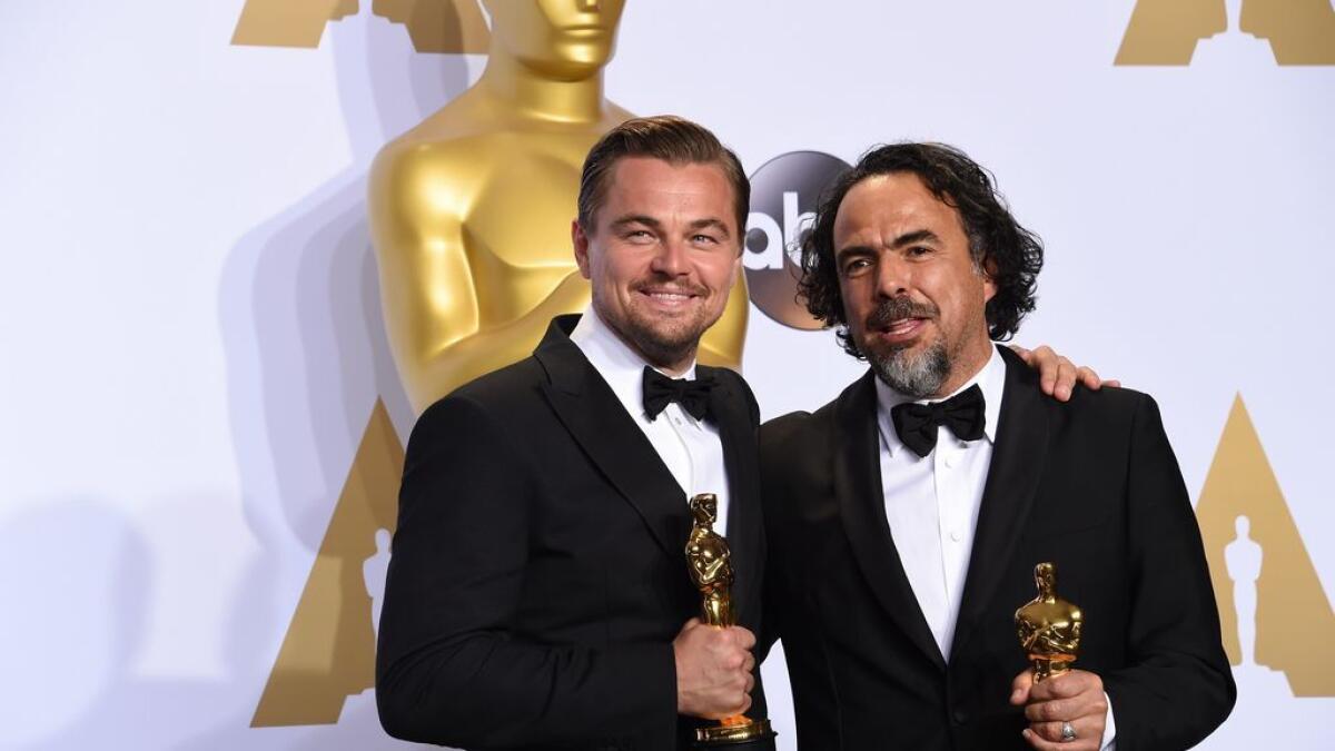 The Revenant's Leonardo DiCaprio and director Alejandro with their Oscars.