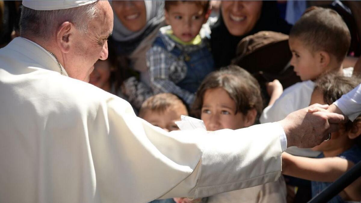  Pope brings 12 Syrian Muslim refugees to Italy