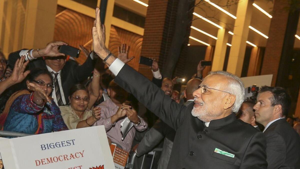 Indian Prime Minister Narendra Modi waves to well wishers after arriving at his hotel ahead of the 2015 General Assembly of the United Nations in Manhattan, New York September 23, 2015.