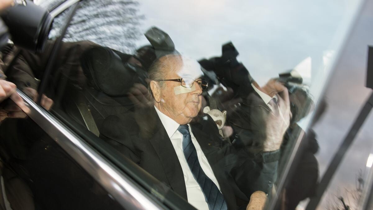 FIFA President Sepp Blatter arrives in a car at the FIFA headquarters “Home of FIFA” in Zurich, Switzerland, Thursday morning, Dec. 17, 2015. While FIFA President Joseph S. Blatter will appear in person on Thursday before the panel of four judges of the F
