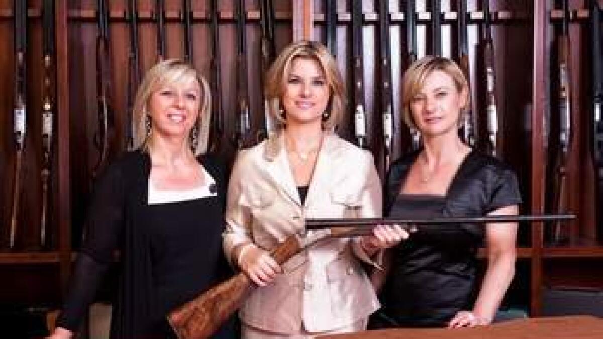 Designer firearms by gun sisters woo customers at Adihex