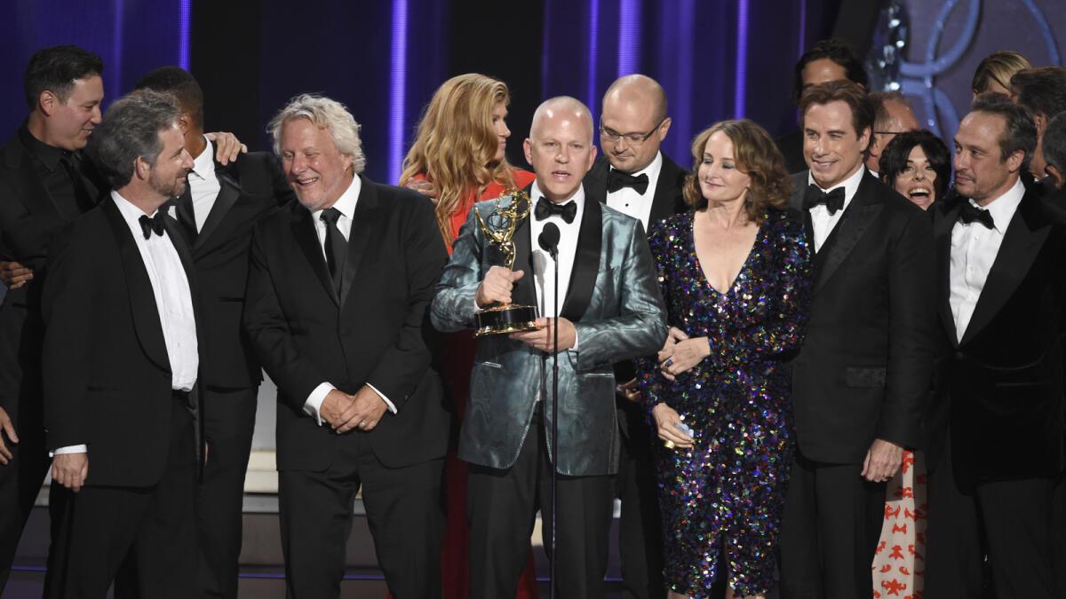 Ryan Murphy and the cast and crew of 'The People v. O.J. Simpson: American Crime Story' accept the award for outstanding limited series at the 68th Primetime Emmy Awards on Sunday, Sept. 18, 2016, at the Microsoft Theater in Los Angeles. AP