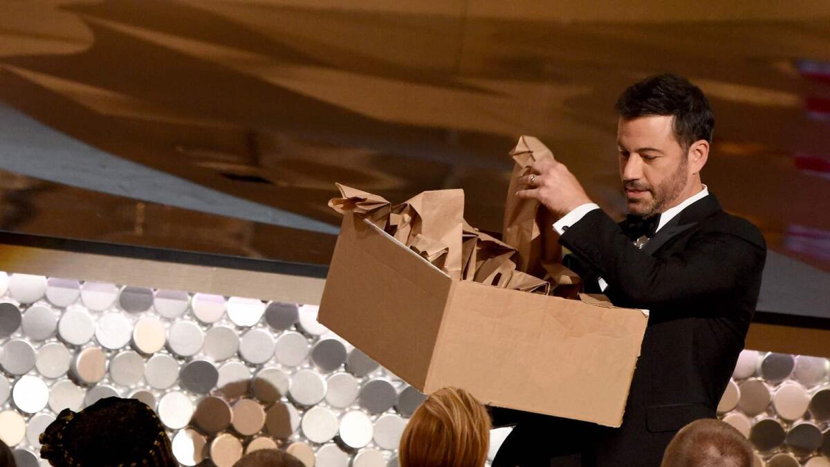 Host Jimmy Kimmel passes out peanut butter and jelly sandwiches to the audience during the 68th Emmy Awards show on September 18, 2016 at the Microsoft Theatre in downtown Los Angeles. AFP