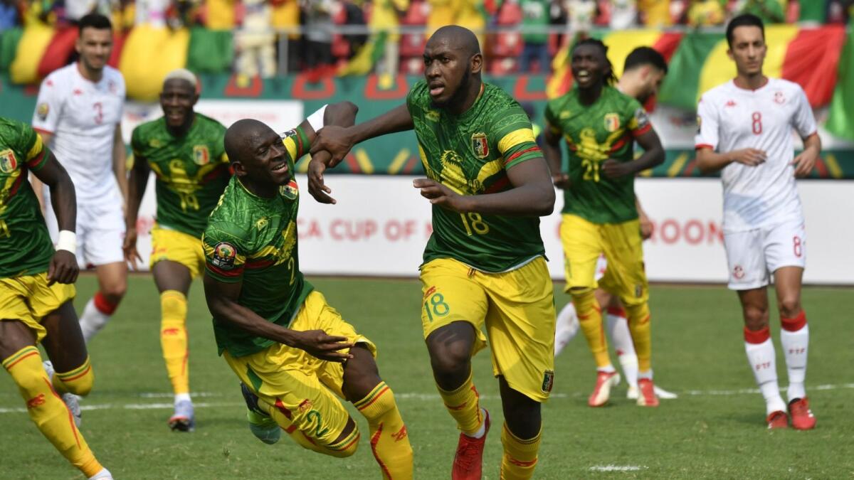 Mali's Ibrahima Kone (centre) celebrates after scoring against Tunisia on Wednesday. — AFP